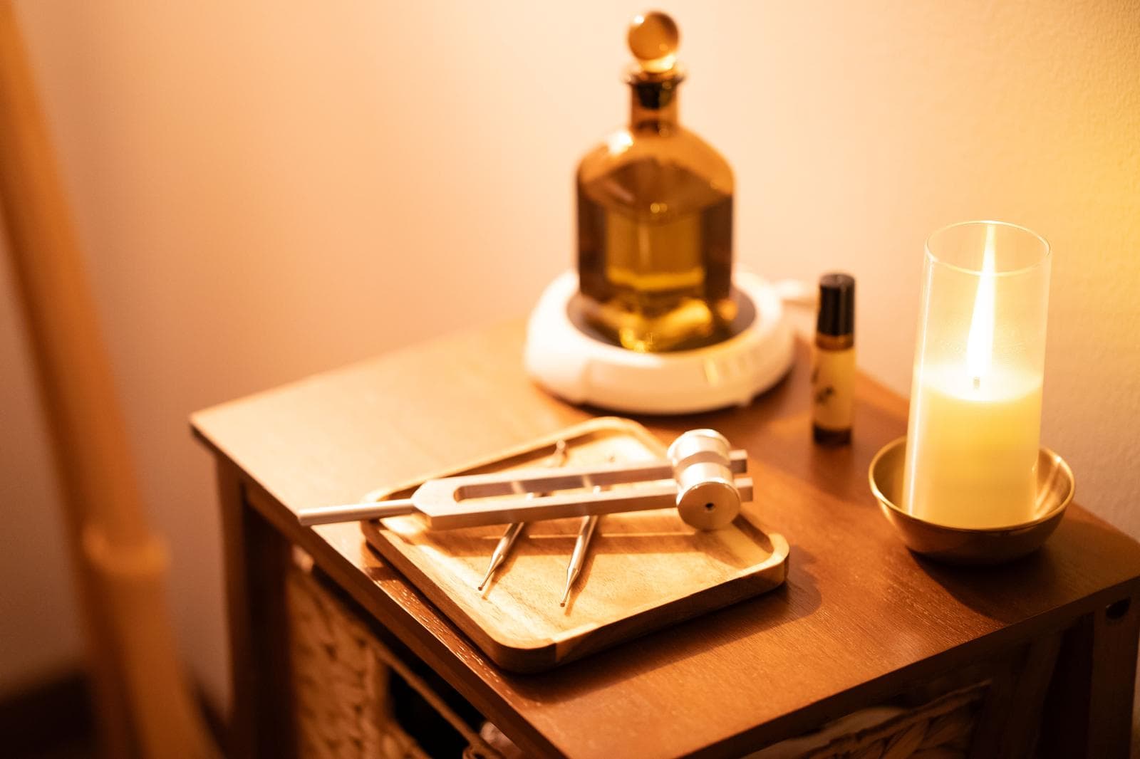 Amber botanical bottles, candlelight and sound tools at Rooted Method Studio
